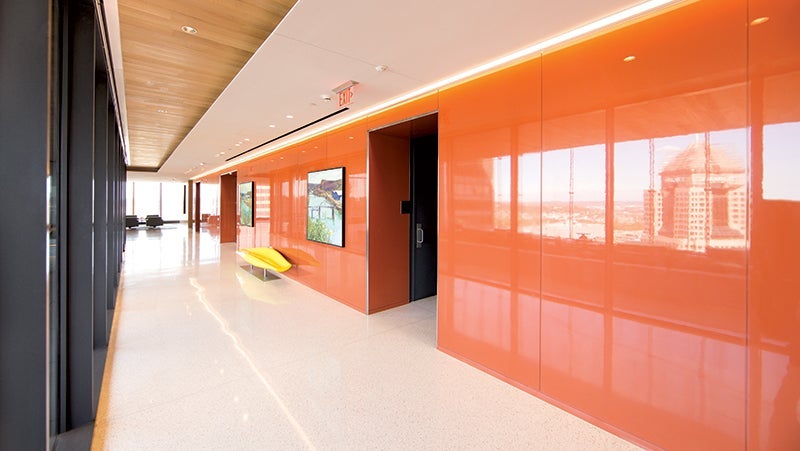 Internal hallway in PNC Plaza with glossy orange walls using PPG's Manor Hall paint.