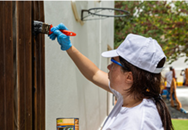 Girl staining wood