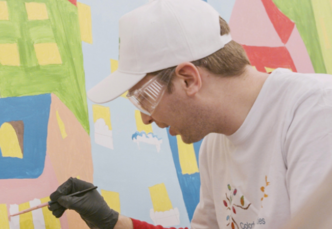 man painting wall mural 