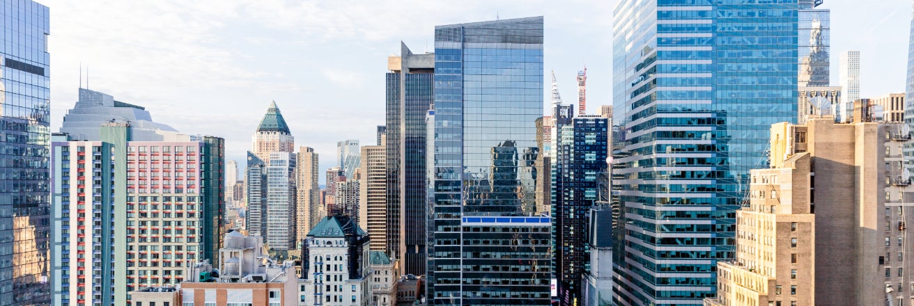 City skyline with a range of glass fronted tall buildings