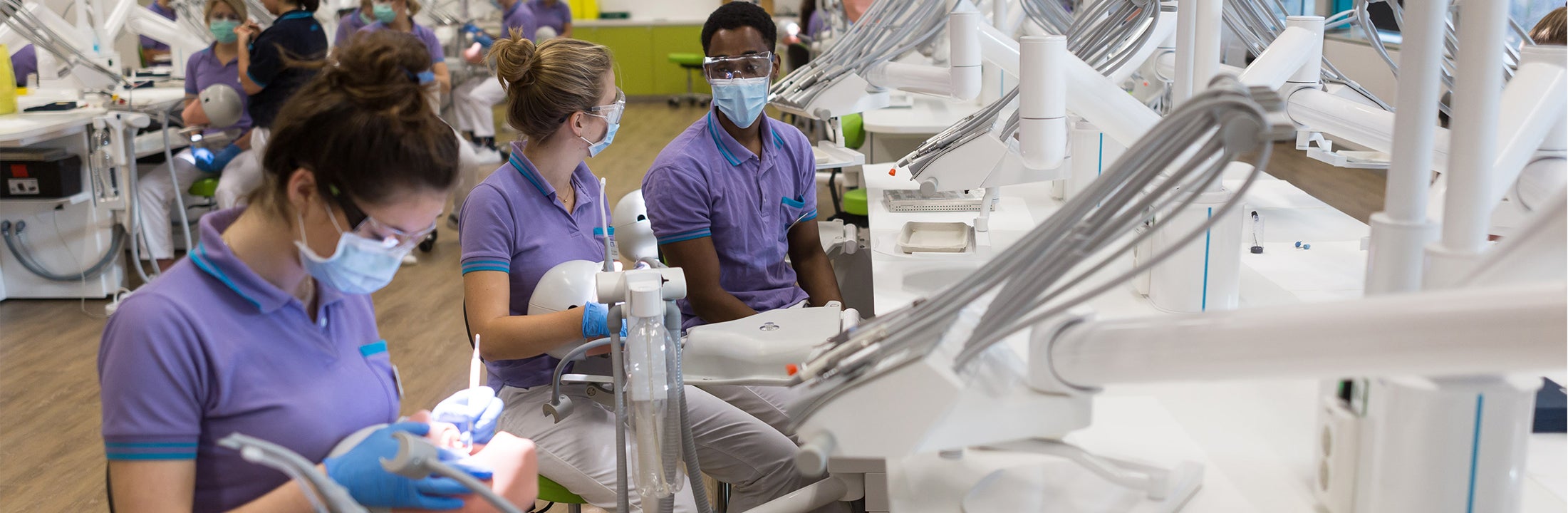 Three students Dentistry working