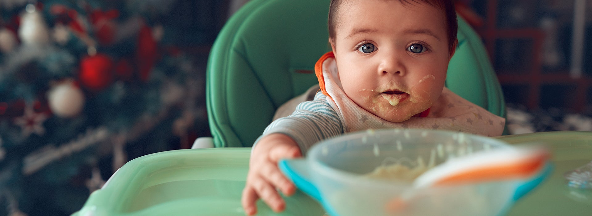 Baby with food rests and a plate