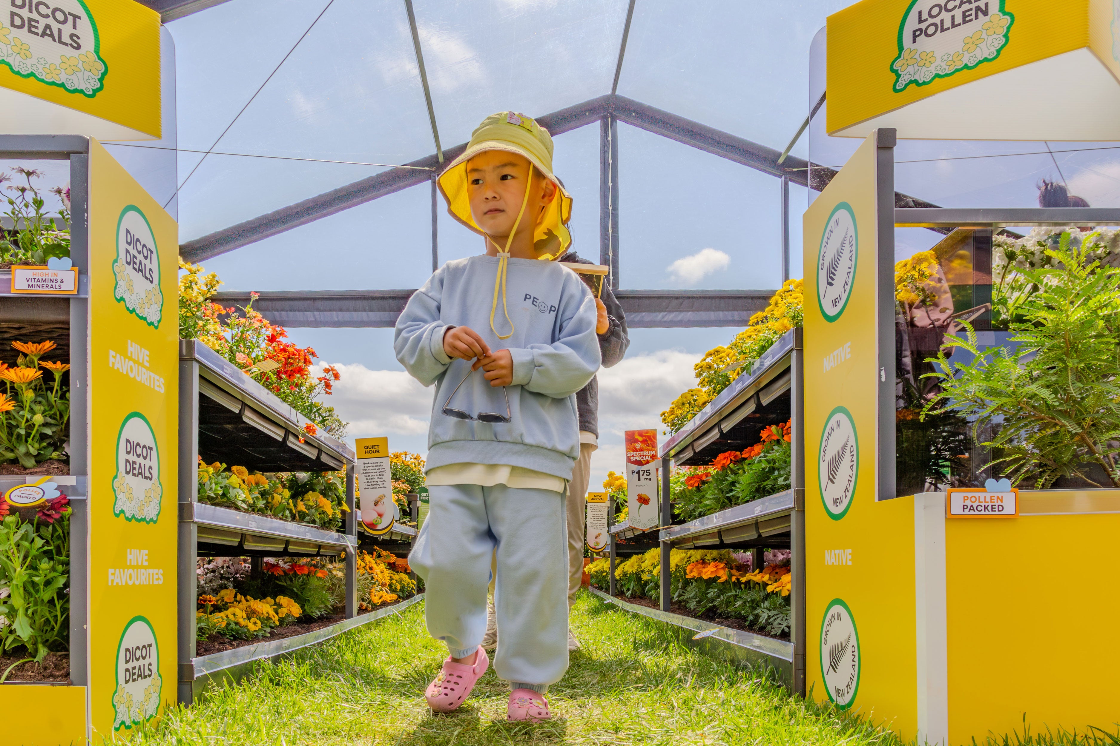 A visitor to the bees supermarket exploring the activation