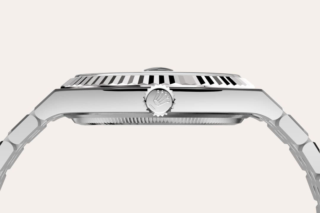 Rolex Land-Dweller 40 in Oyster, 40 mm, Oystersteel and white gold with a Intense white, honeycomb motif dial, Fluted bezel, and Flat Jubilee, five-piece solid links bracelet