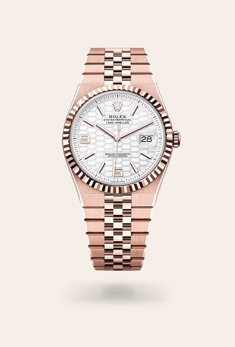 Rolex Land-Dweller 40 in Oyster, 40 mm, Everose gold with a Intense white, honeycomb motif dial, Fluted bezel, and Flat Jubilee, five-piece solid links bracelet
