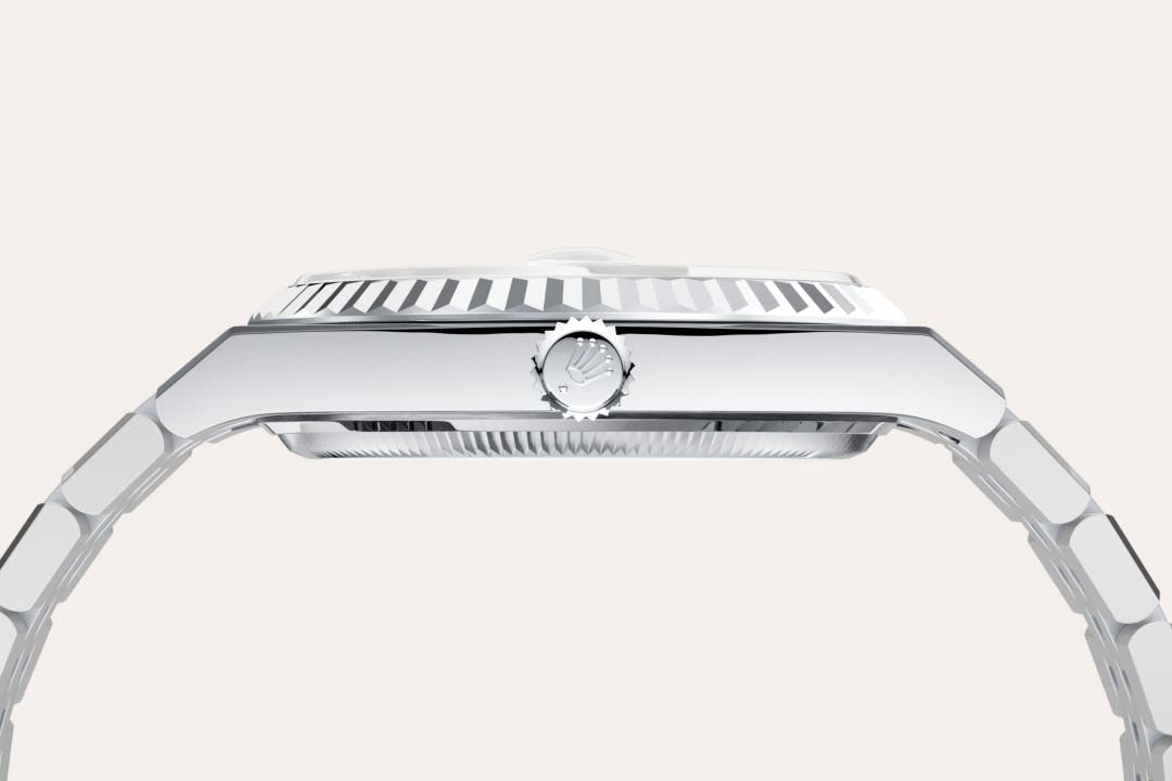 Rolex Land-Dweller 36 in Oyster, 36 mm, platinum with a Ice blue, honeycomb motif dial, Fluted bezel, and Platinum bracelet