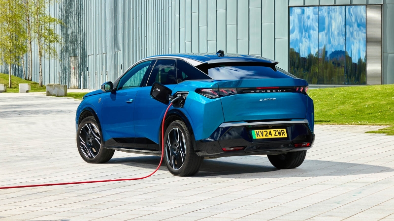Peugeot e-3008 in blue, charging, rear three quarter static