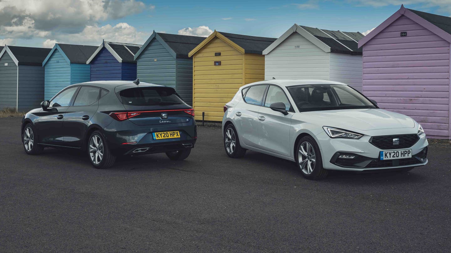 SEAT Leon hatchbacks parked next to beach huts