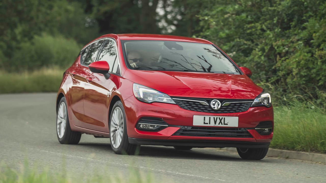 Red Vauxhall Astra driving