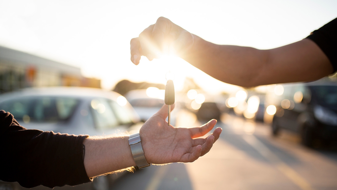 Car keys being handed over