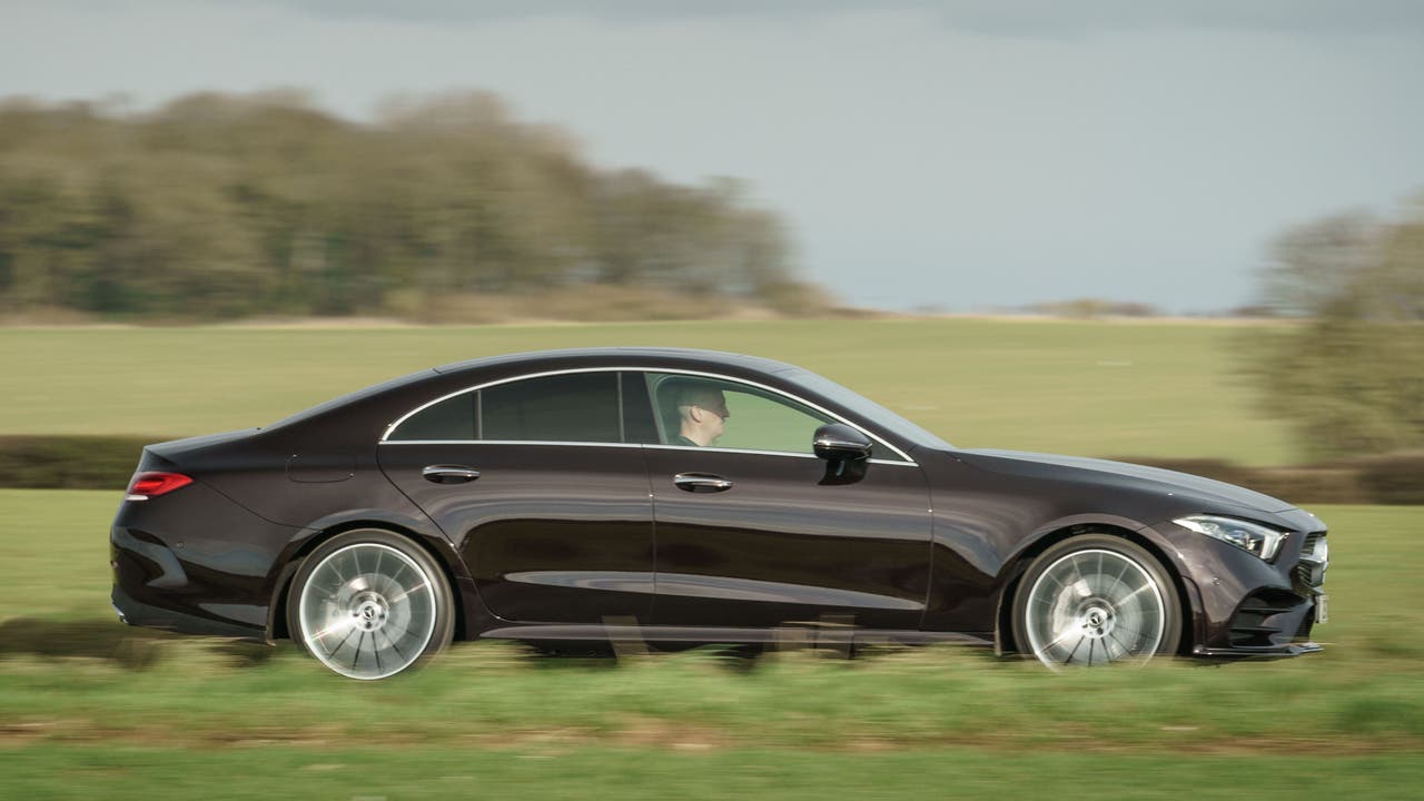 Mercedes CLS 400d driving - side view