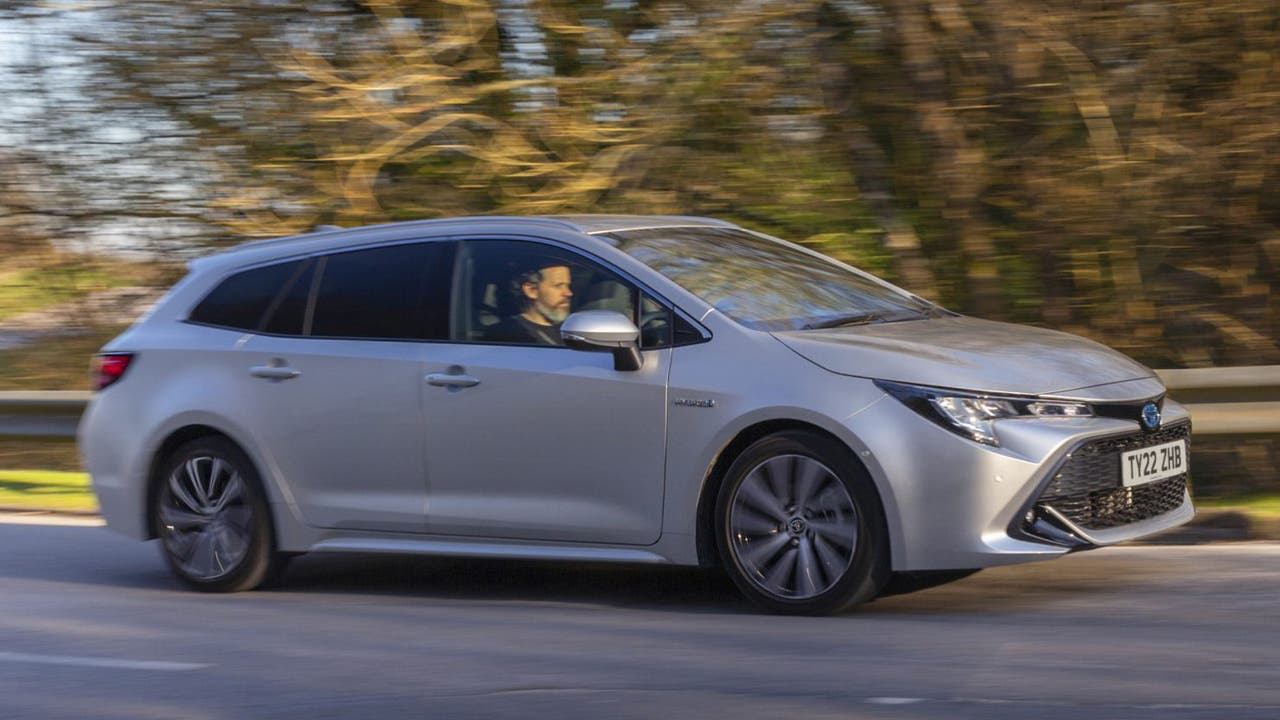 Toyota Corolla Touring Sport in silver, driving shot