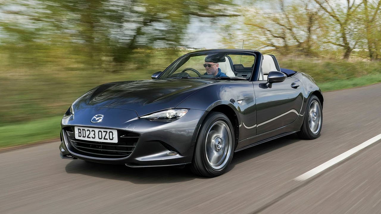 Mazda MX-5 in grey, driving shot