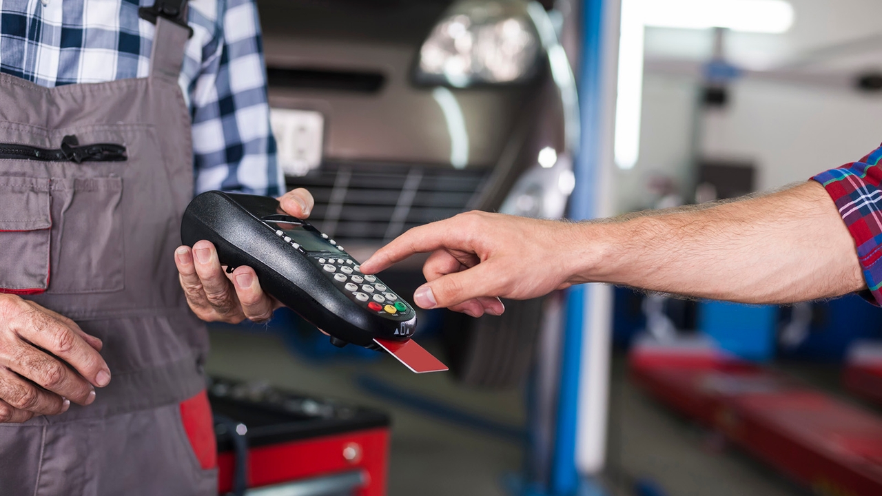 Person paying for car service