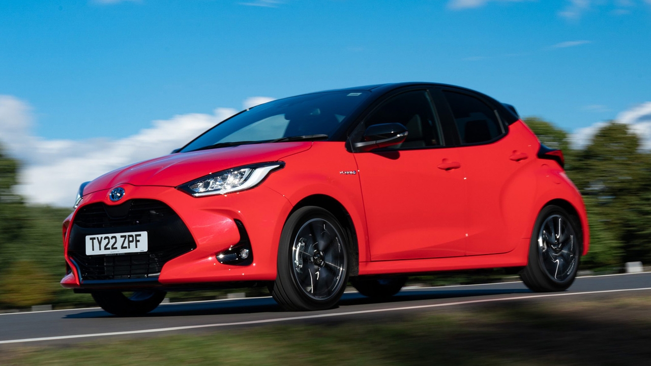 Toyota Yaris in red, driving shot