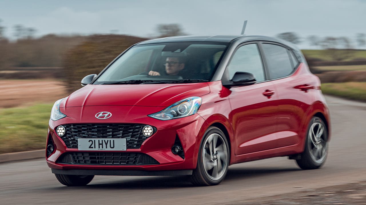 Hyundai i10 in red, driving shot