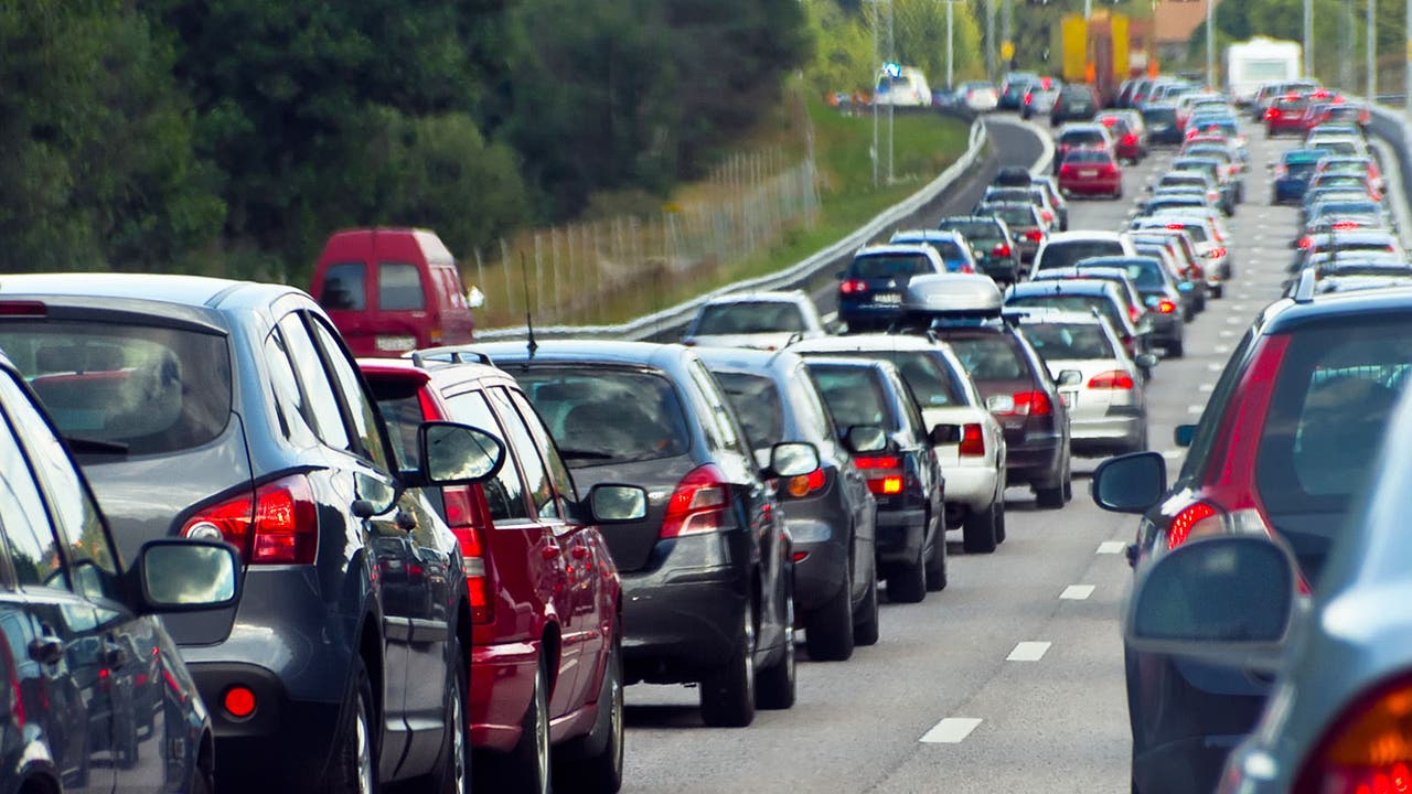 A busy motorway with queueing traffic