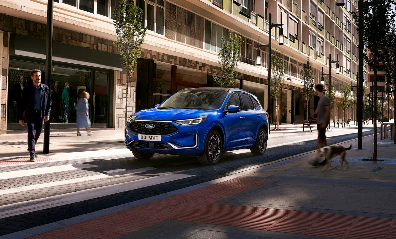 2024 Ford Kuga in blue, driving