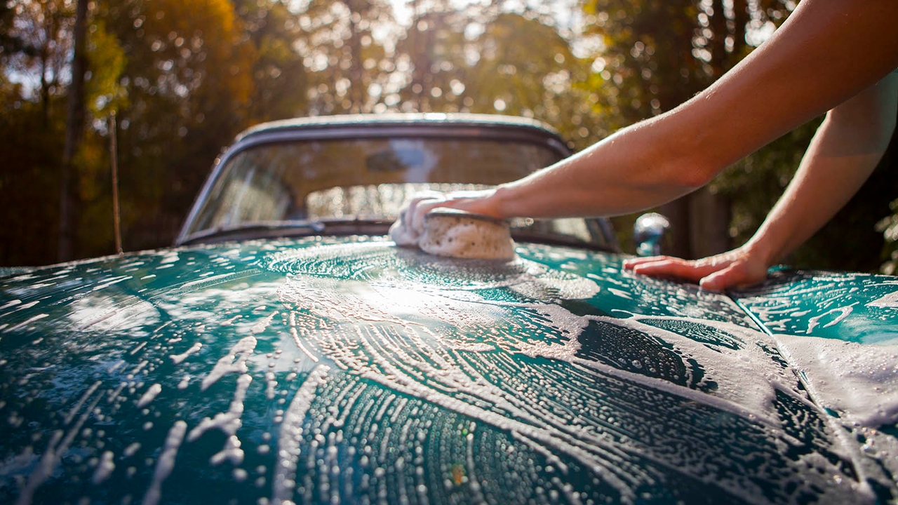 Light blue car being cleaned