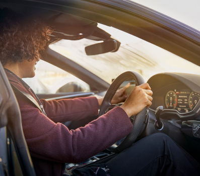 Woman behind steering wheel