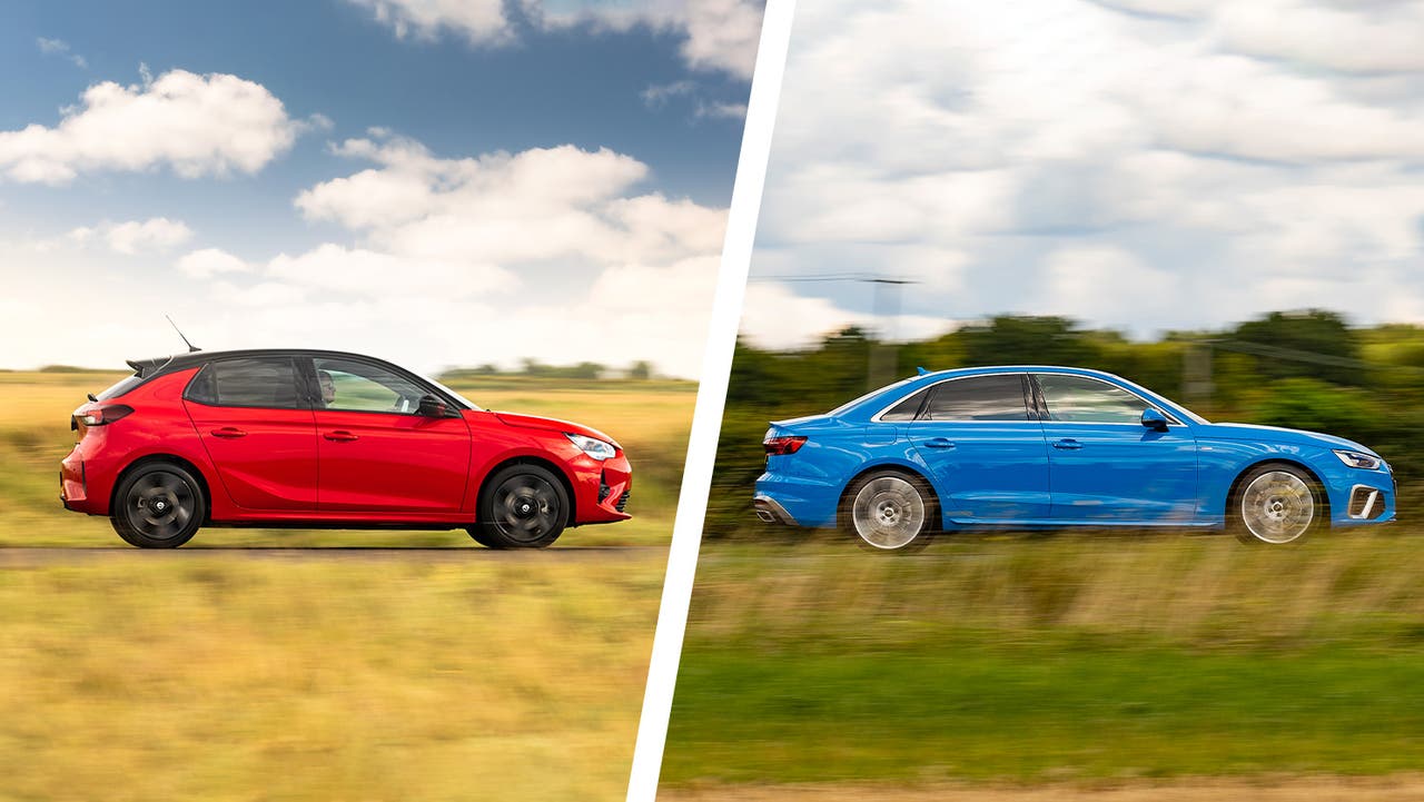 Vauxhall Corsa hatchback in red vs Audi A4 saloon in blue. Side-on driving shot.