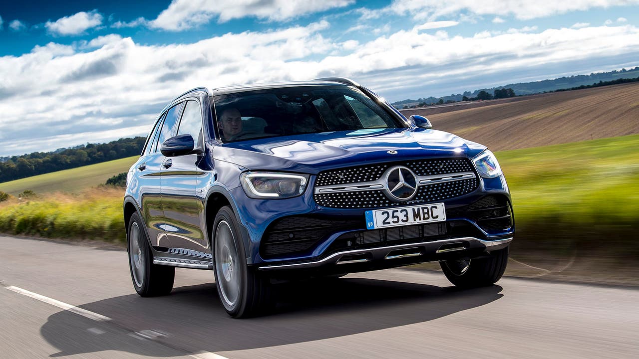 A Mercedes GLC in blue, driving shot