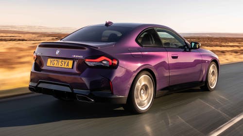 BMW 2 Series coupe driving rear view