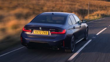 BMW 3 Series driving rear view