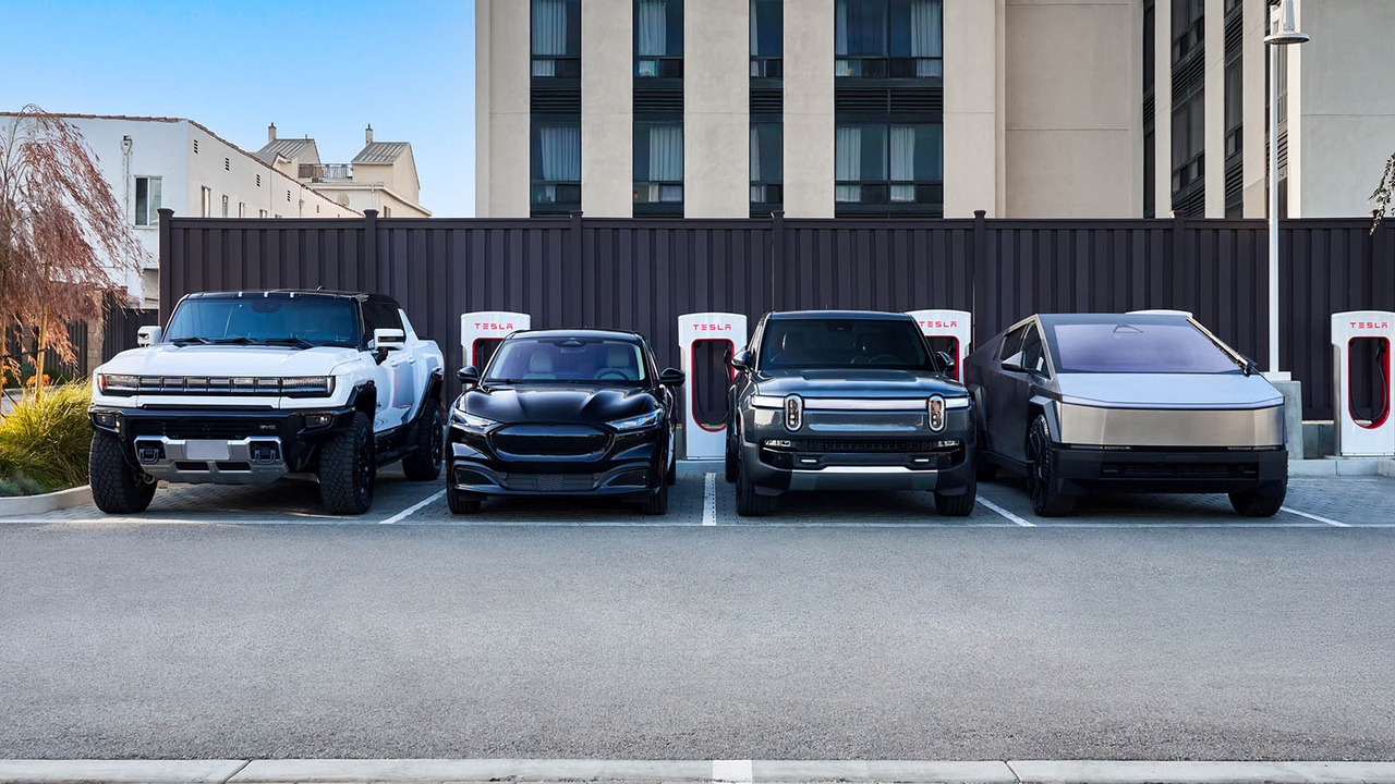 Several different brands of car using Tesla Superchargers