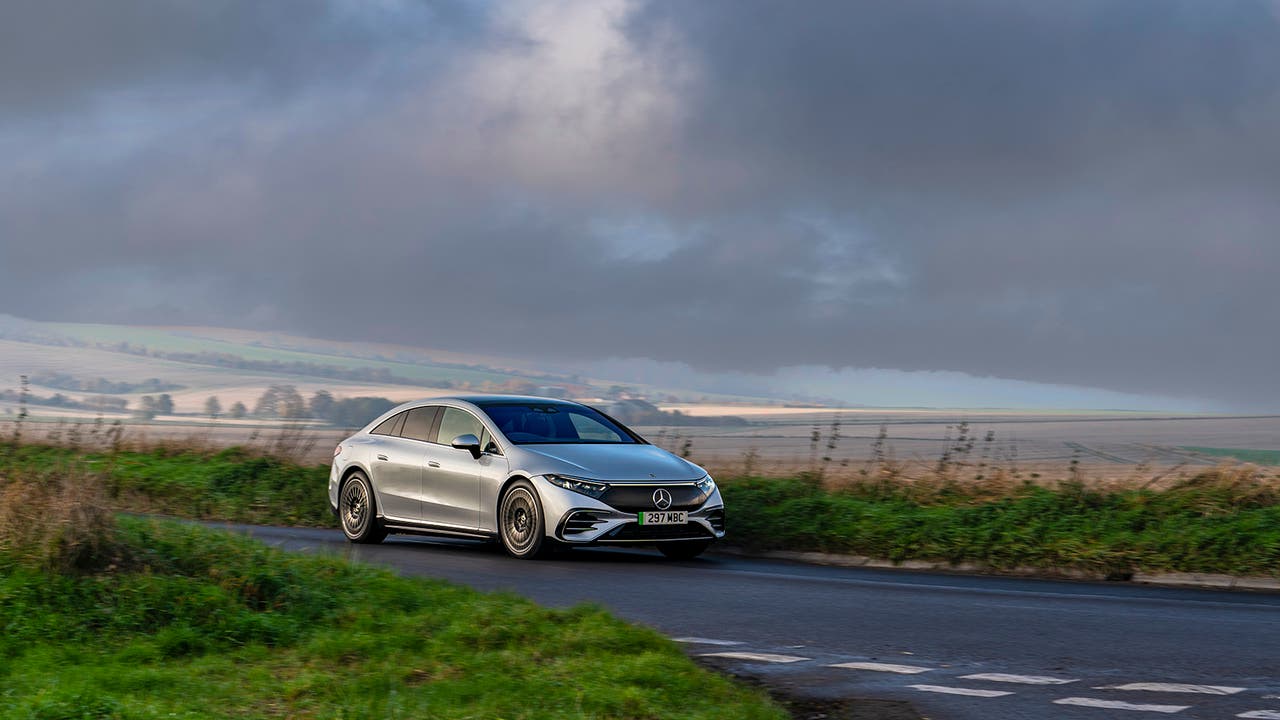 Mercedes EQS in silver, driving shot.