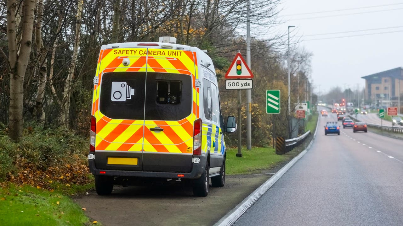 A marked police speed van parked in a lay-by