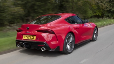 Toyota GR Supra driving rear/side view
