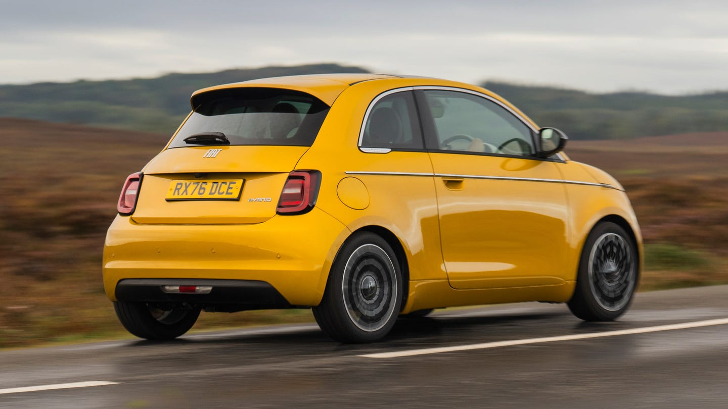 Fiat 500 Hybrid driving in countryside, rear view