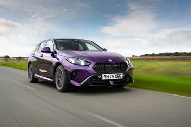 2025 BMW 1 Series 120 in purple driving