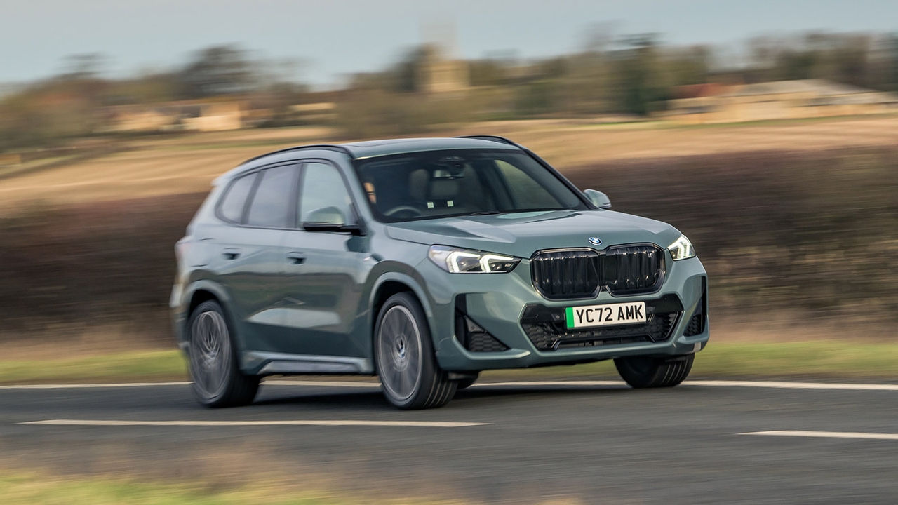 BMW iX1 in grey, driving shot