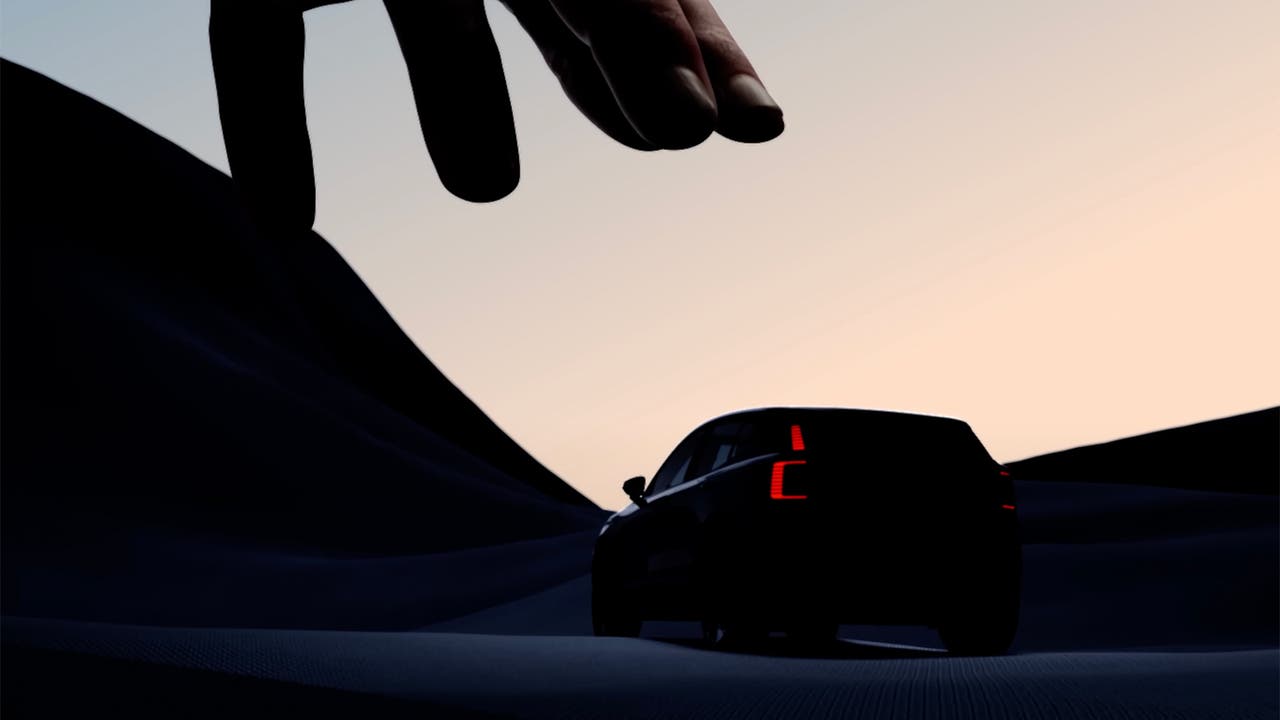 Volvo EX30 teaser image, massive hand grabbing car