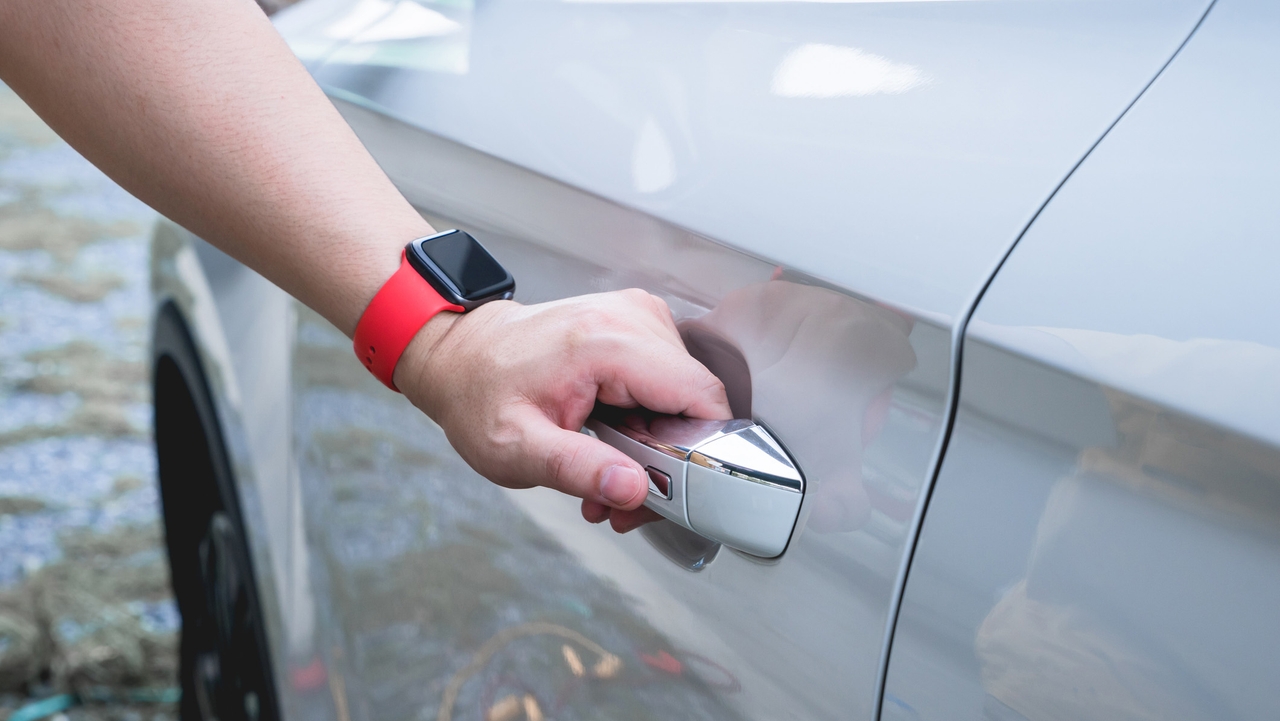 Man opening keyless entry car