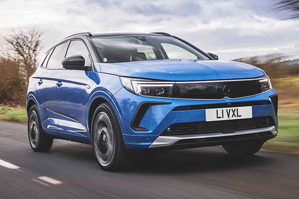 Blue Vauxhall Grandland driving