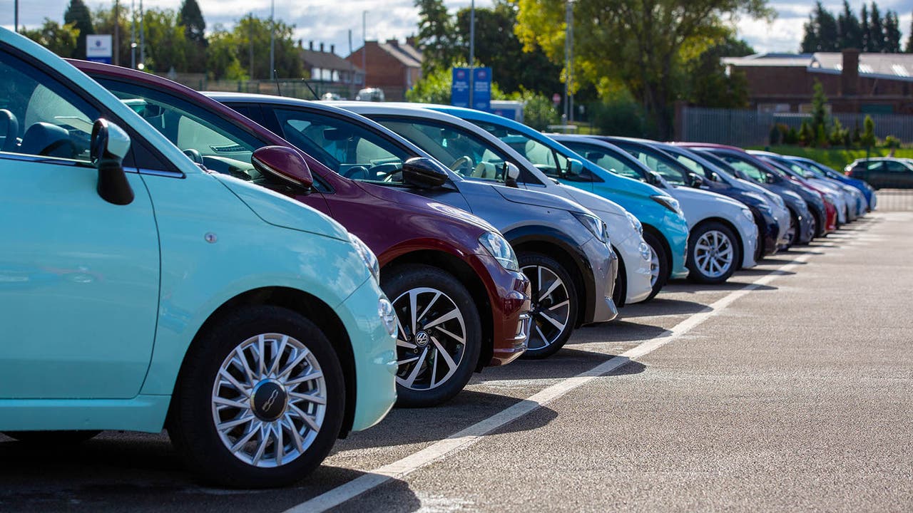 Row of cars for sale at a Motorpoint store