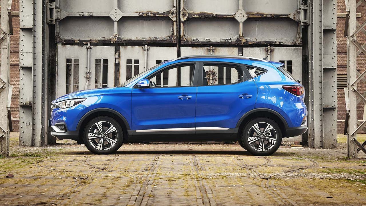 MG ZS EV in blue static shot from side in an industrial area