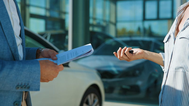 Customer and dealer arranging car part exchange