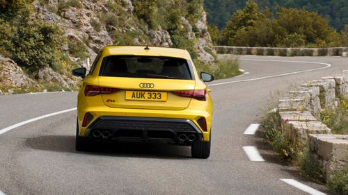 Audi S3 driving rear view
