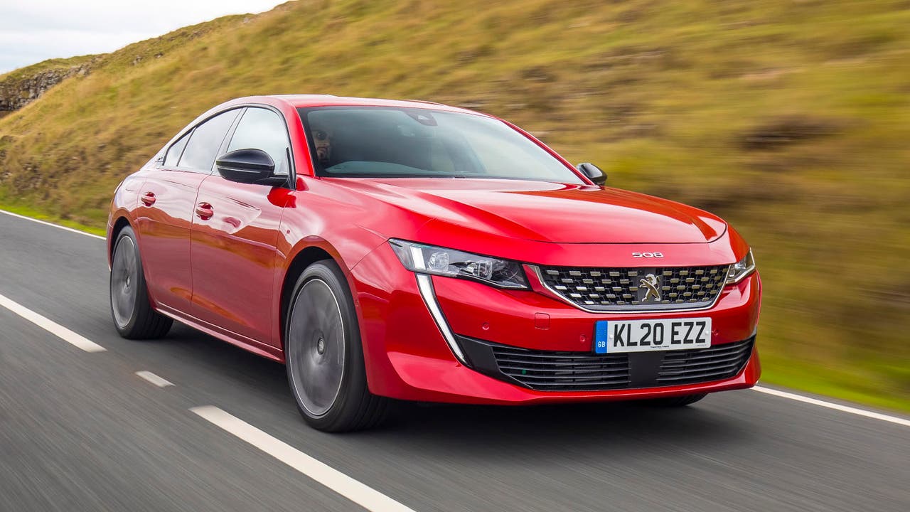 Peugeot 508 in red, driving shot