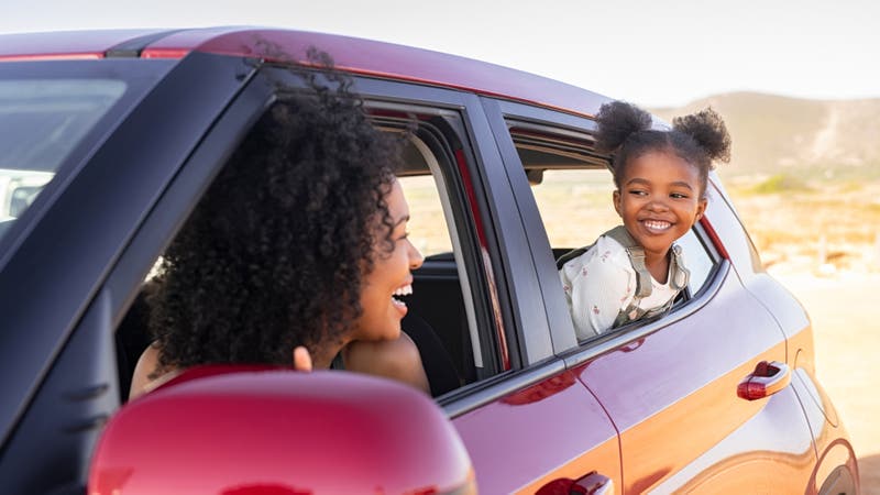 Mother and daughter in compact family car