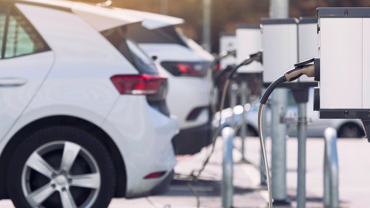 White Volkswagen ID.3 EV plugged in and charging