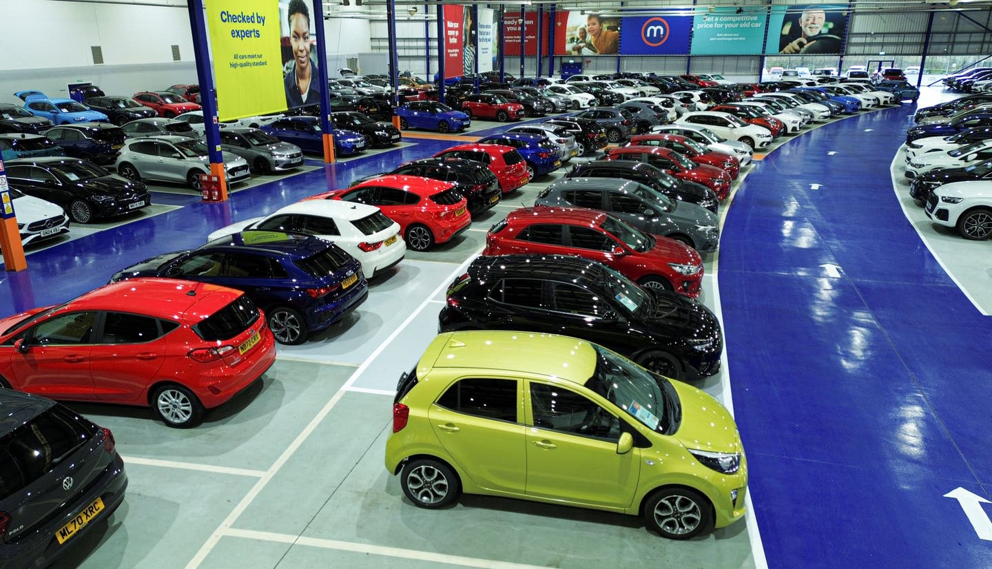 cars for sale lined up inside motorpoint store