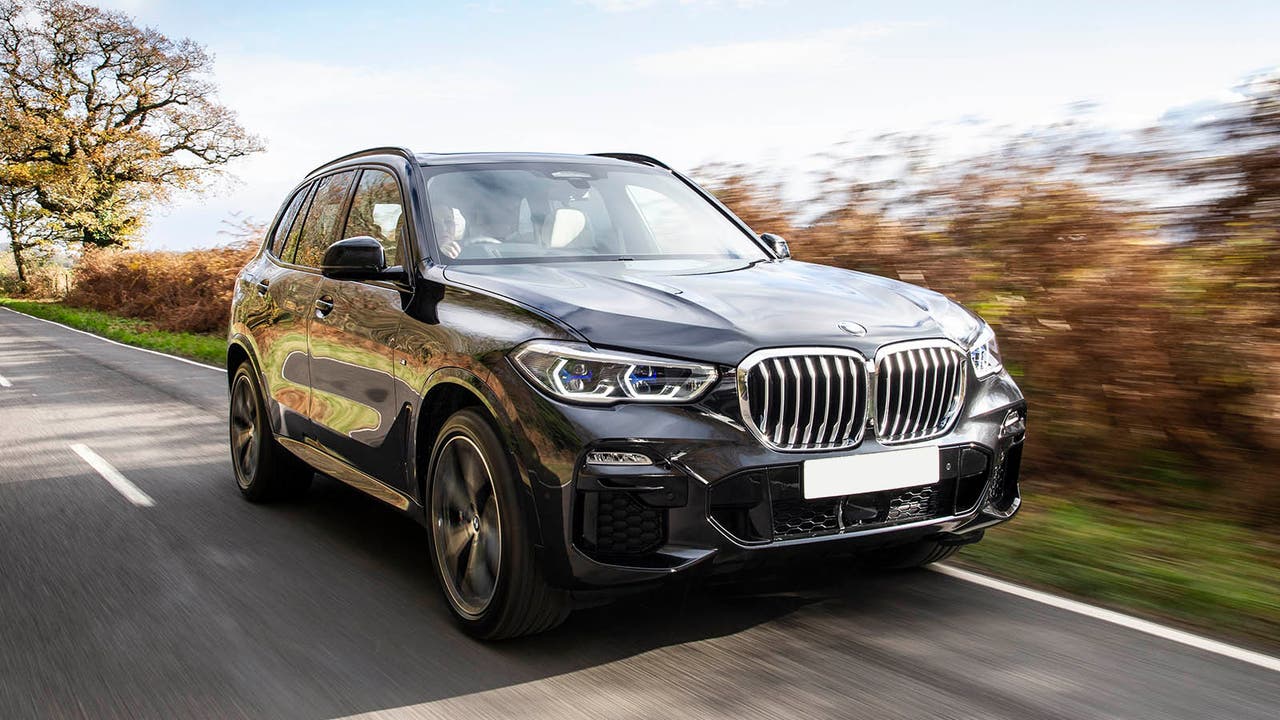 BMW X5 in grey, driving shot