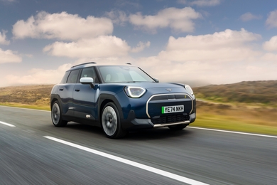 Mini Aceman blue front three quarters driving facing right