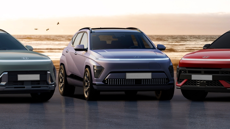 Three Hyundai Kona SUVs parked on a beach