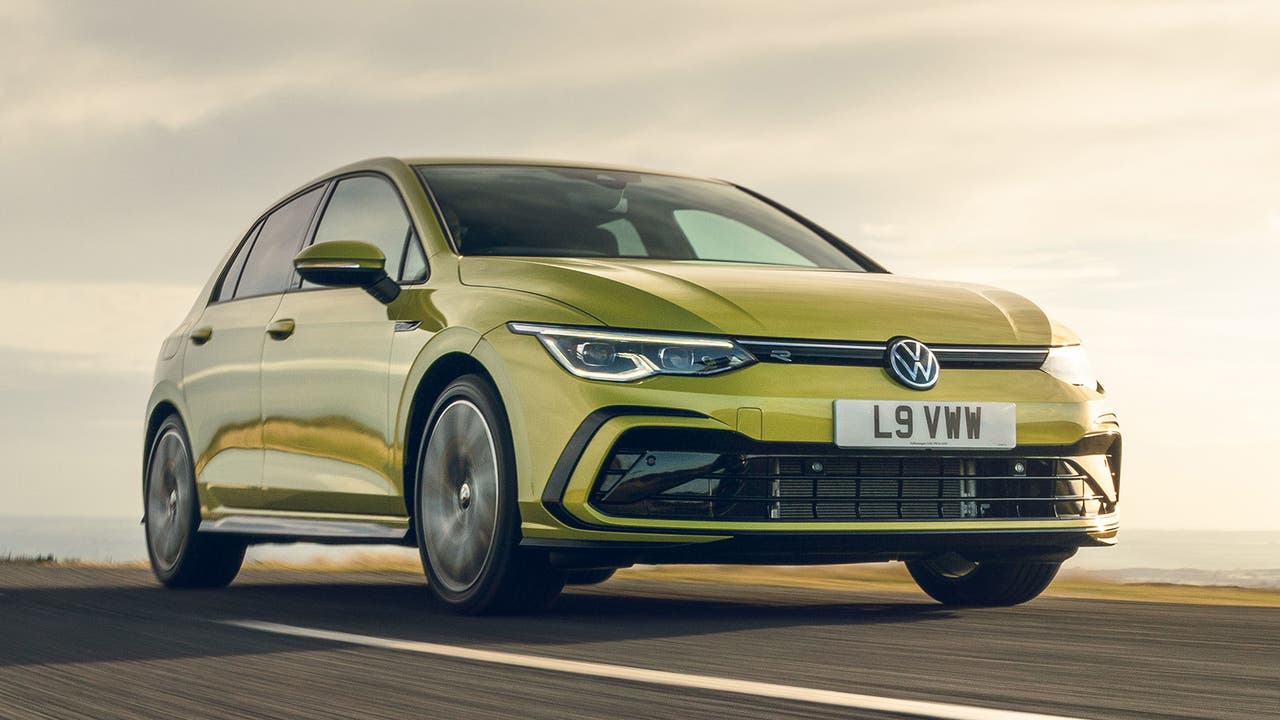 Volkswagen Golf in yellow, driving shot